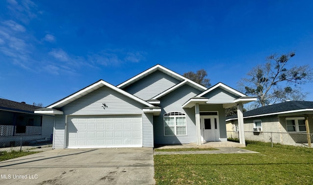 ranch-style house with a garage, concrete driveway, a front yard, and fence