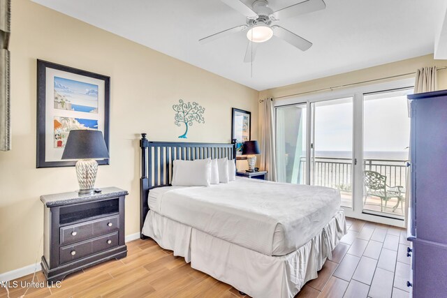 bedroom featuring access to exterior, ceiling fan, baseboards, and wood finished floors