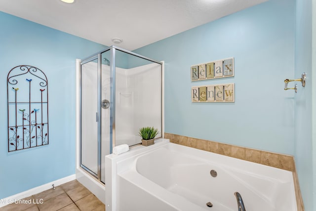 full bath with a garden tub, tile patterned flooring, and a shower stall