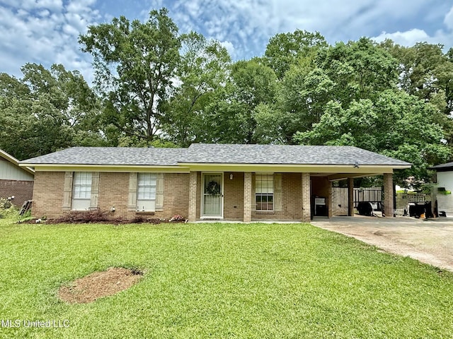 412 Monica Ln, Pearl, MS 39208 - single story home with driveway, a front lawn, a carport, and brick siding