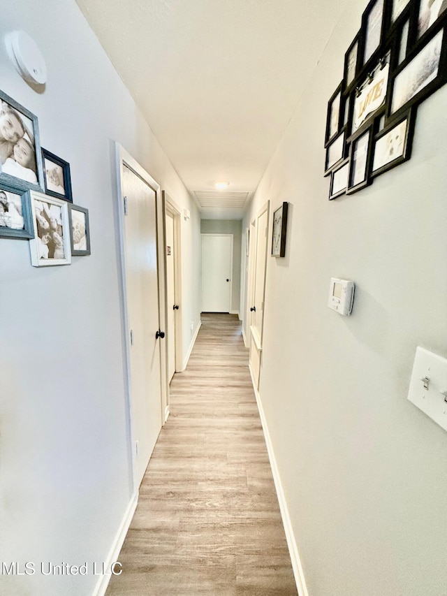 412 Monica Ln, Pearl, MS 39208 - hall featuring light wood-type flooring and baseboards