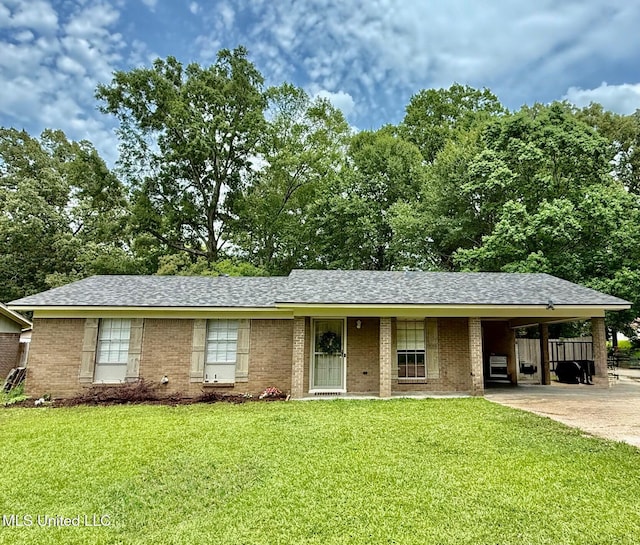 412 Monica Ln, Pearl, MS 39208 - ranch-style house with a front yard, concrete driveway, a carport, roof with shingles, and brick siding