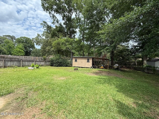 412 Monica Ln, Pearl, MS 39208 - view of yard with an outdoor structure, a shed, and view of scattered trees