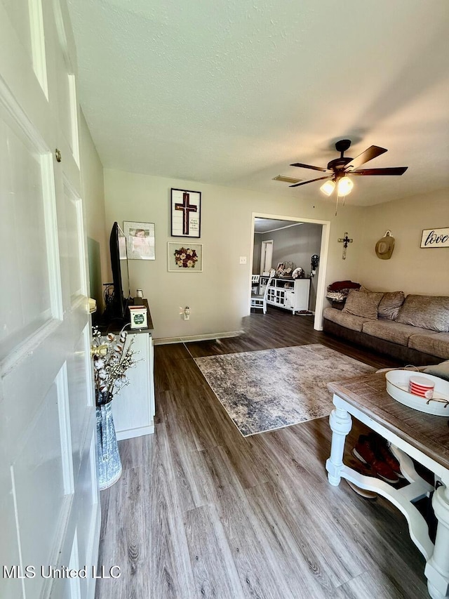 412 Monica Ln, Pearl, MS 39208 - living area featuring ceiling fan, wood finished floors, and a textured ceiling