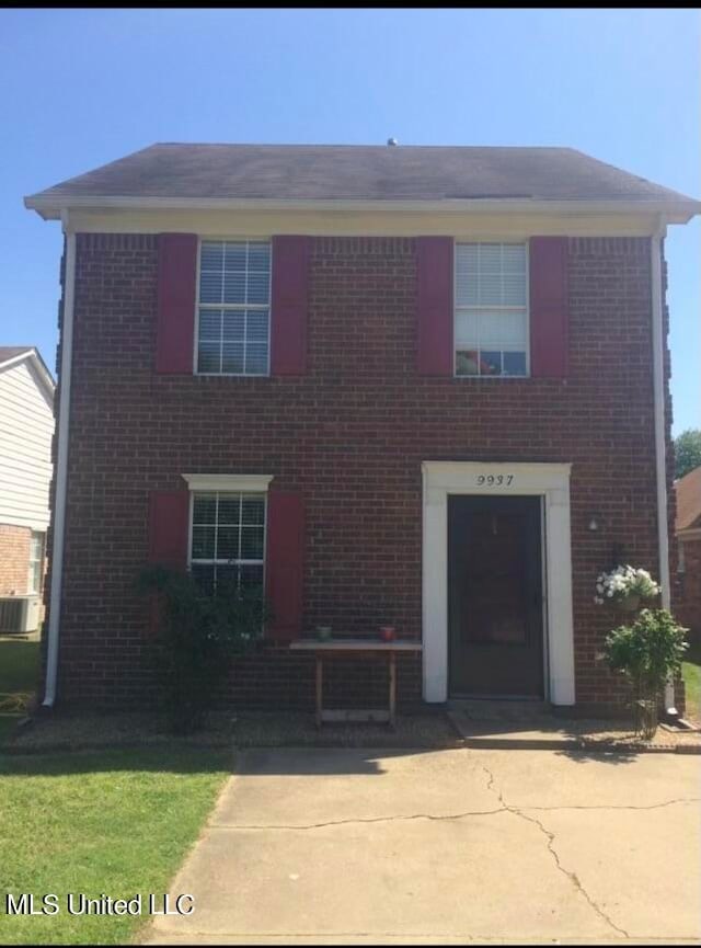 view of front of property featuring cooling unit