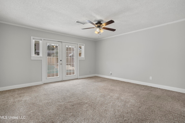 carpeted empty room featuring ceiling fan, french doors, a textured ceiling, and ornamental molding