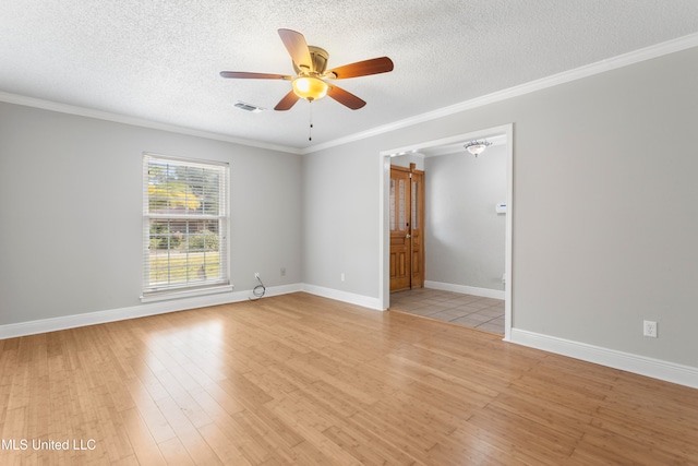 empty room with ceiling fan, ornamental molding, a textured ceiling, and light wood-type flooring