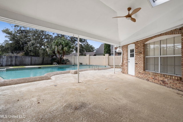 view of swimming pool with ceiling fan and a patio area