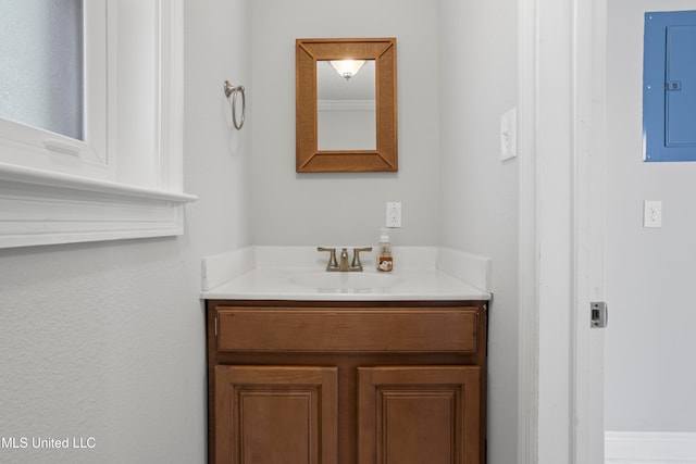 bathroom featuring electric panel and vanity