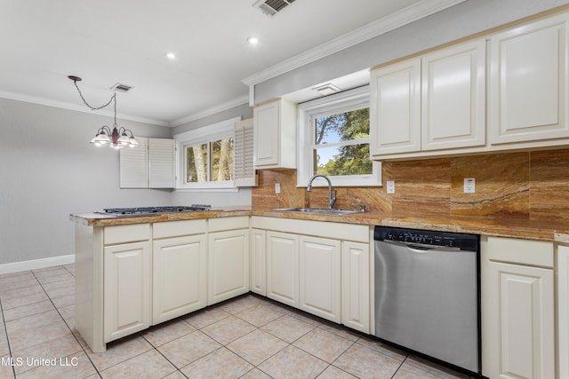 kitchen featuring sink, hanging light fixtures, stainless steel appliances, a notable chandelier, and light tile patterned floors