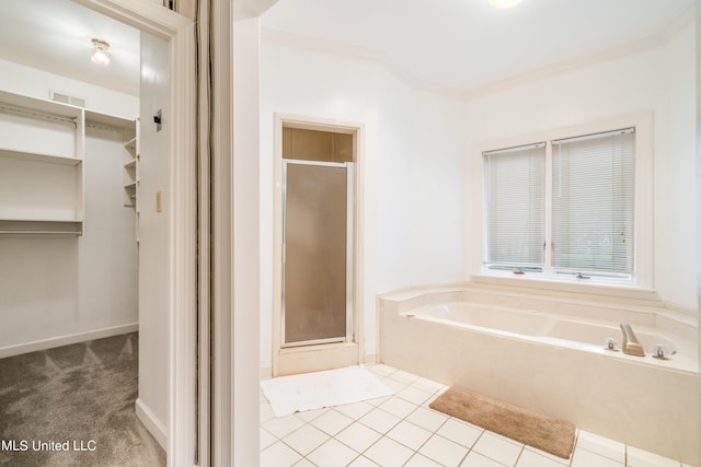 bathroom featuring tile patterned flooring and plus walk in shower