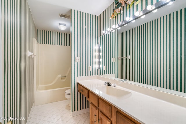 full bathroom featuring tile patterned flooring, vanity, bathtub / shower combination, and toilet