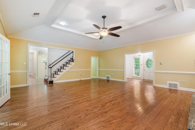 empty room featuring ceiling fan, wood-type flooring, and crown molding