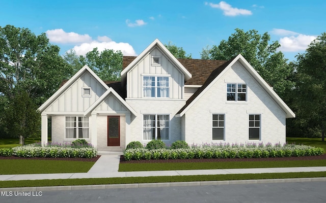 3919 Mcelroy Farms Dr, Olive Branch, MS 38654 - view of front facade with board and batten siding, a front lawn, and brick siding