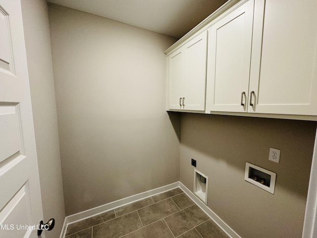 3919 Mcelroy Farms Dr, Olive Branch, MS 38654 - washroom featuring cabinet space, washer hookup, electric dryer hookup, and dark tile patterned floors