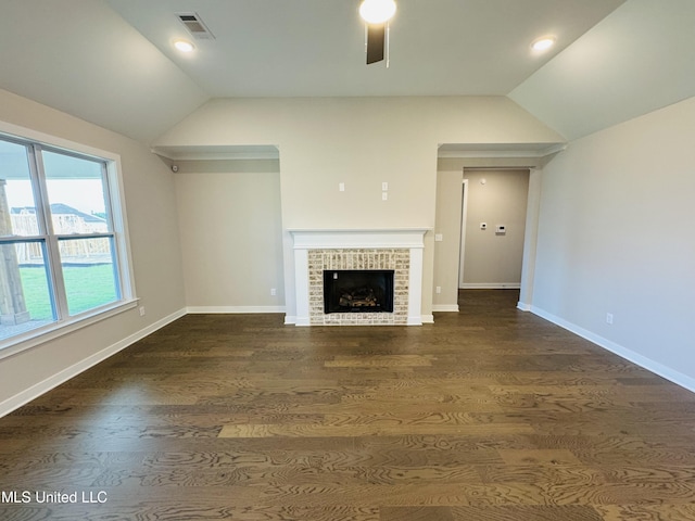 3919 Mcelroy Farms Dr, Olive Branch, MS 38654 - unfurnished living room with vaulted ceiling, a ceiling fan, dark wood-type flooring, and a brick fireplace