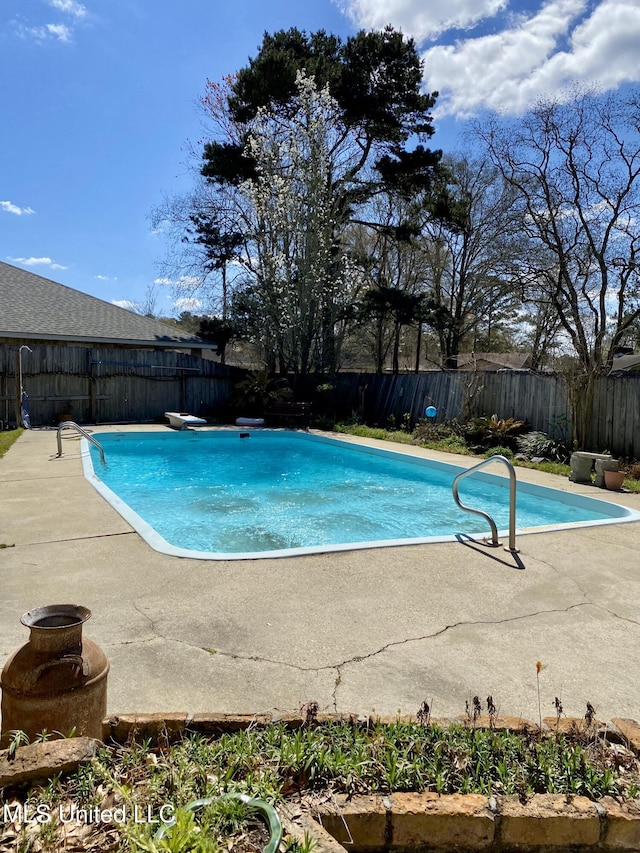 view of swimming pool with a patio, a fenced backyard, and a fenced in pool