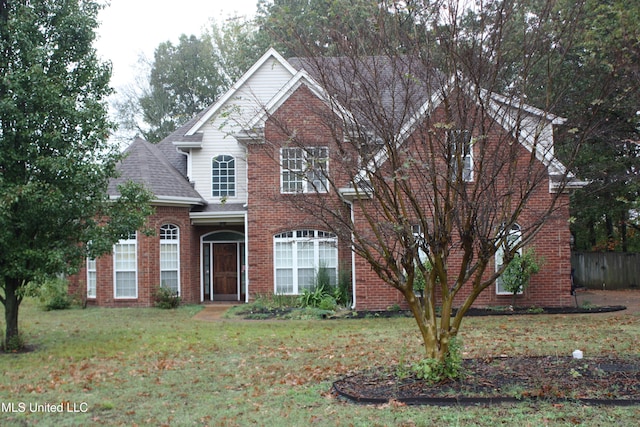 front facade with a front lawn