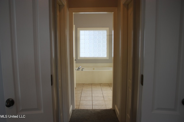 hallway with light tile patterned floors