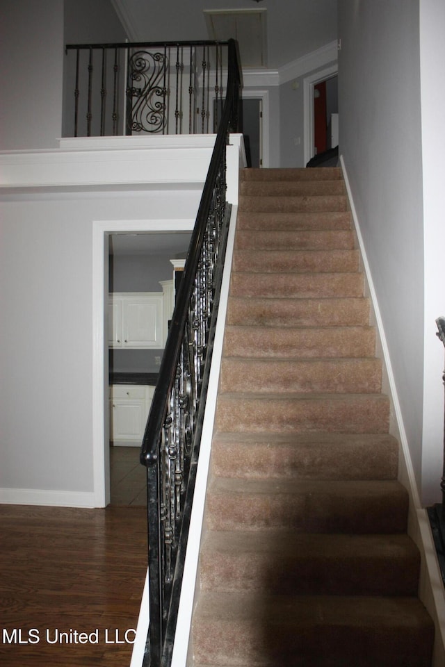 stairway featuring hardwood / wood-style floors