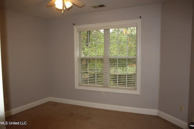 empty room featuring carpet flooring and ceiling fan