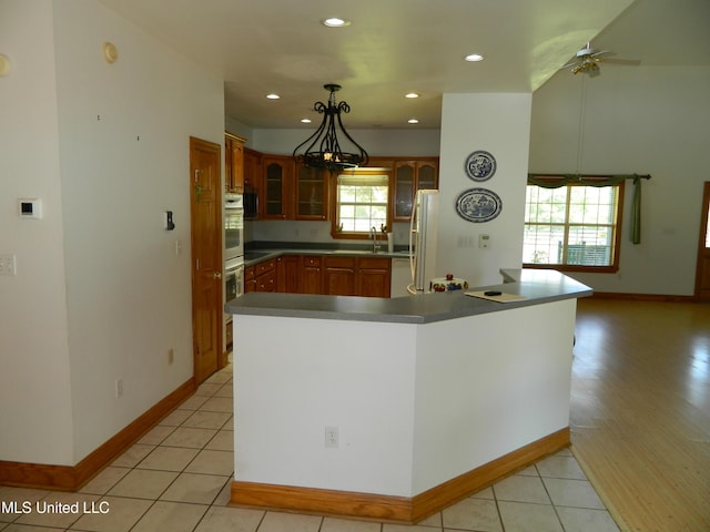 kitchen with white appliances, glass insert cabinets, ceiling fan, baseboards, and recessed lighting