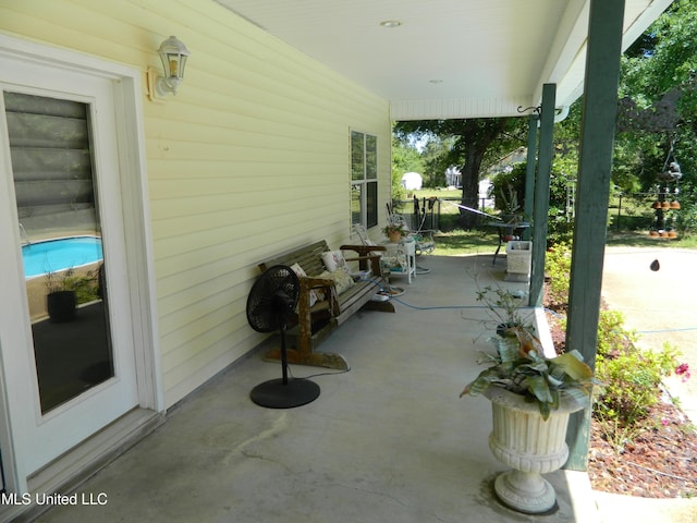 view of patio featuring a porch