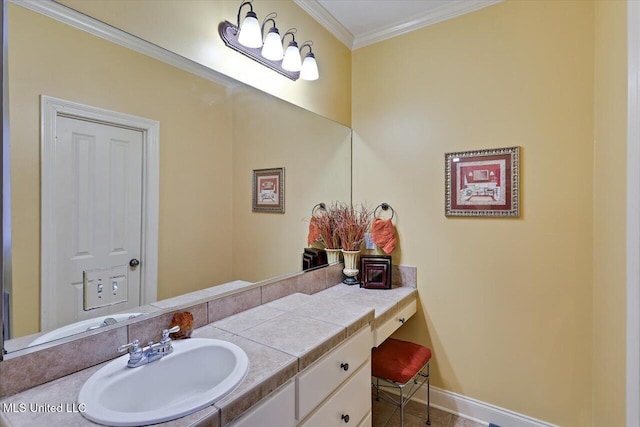 bathroom featuring crown molding and vanity