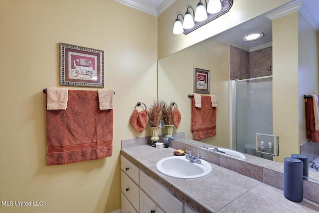 bathroom with a shower with shower door, vanity, and crown molding