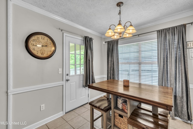 1201 Arbor Hill Dr, Brandon, MS 39042 - dining room featuring a chandelier, light tile patterned floors, a textured ceiling, crown molding, and baseboards