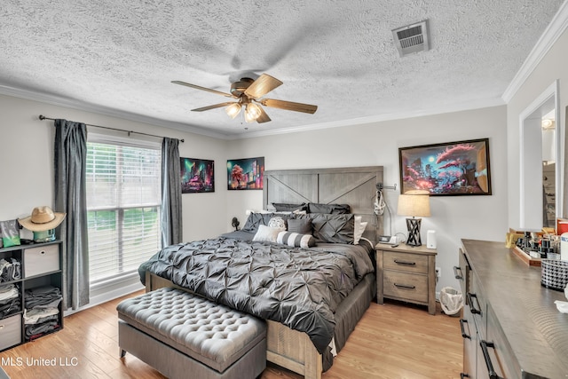 1201 Arbor Hill Dr, Brandon, MS 39042 - bedroom featuring light wood-type flooring, ornamental molding, ceiling fan, and a textured ceiling