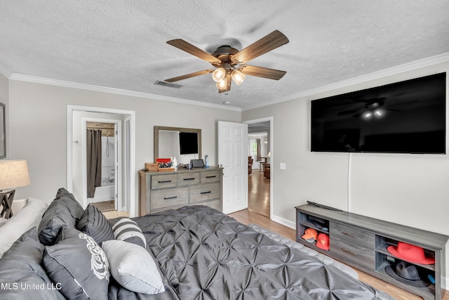 1201 Arbor Hill Dr, Brandon, MS 39042 - bedroom with light wood-style flooring, a textured ceiling, crown molding, a ceiling fan, and baseboards