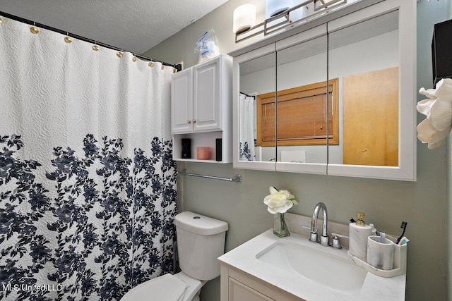 bathroom with toilet, a textured ceiling, and vanity