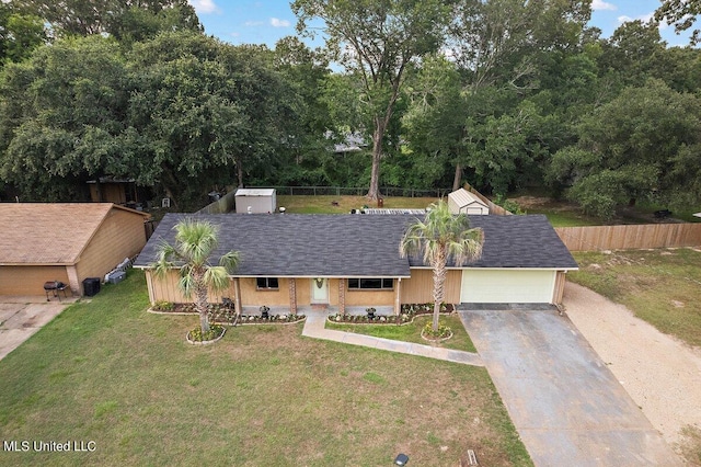 view of front facade featuring a front lawn and a garage