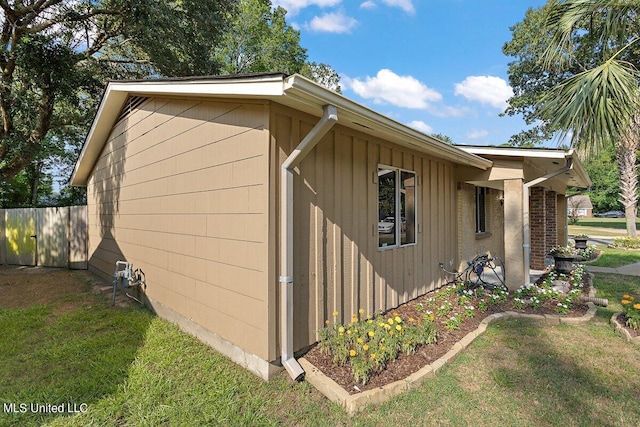 view of home's exterior with a yard