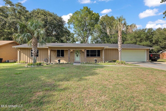 ranch-style home with a front lawn and a garage