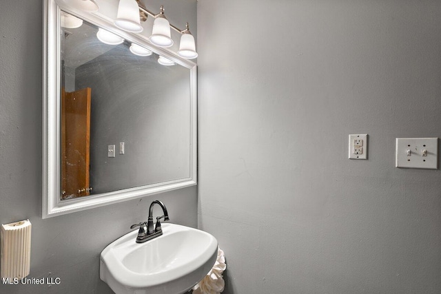 bathroom featuring sink and radiator heating unit