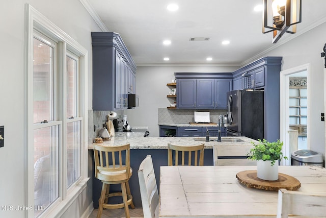 108 Kenbridge Ln, Madison, MS 39110 - kitchen featuring a sink, freestanding refrigerator, backsplash, blue cabinetry, and a peninsula