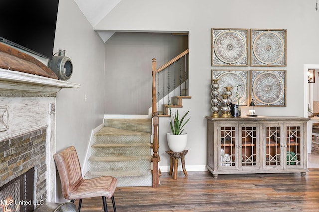 108 Kenbridge Ln, Madison, MS 39110 - stairway featuring a warm lit fireplace, wood finished floors, and baseboards