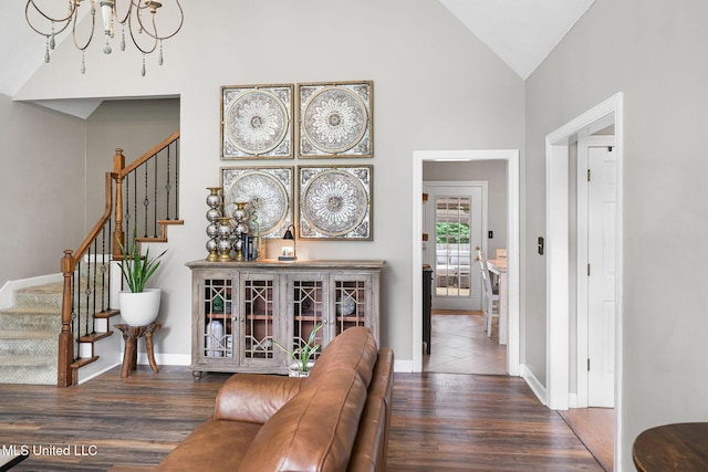 108 Kenbridge Ln, Madison, MS 39110 - hall featuring a chandelier, wood finished floors, stairway, baseboards, and high vaulted ceiling