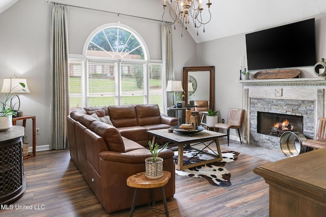 108 Kenbridge Ln, Madison, MS 39110 - living area with a fireplace, high vaulted ceiling, wood finished floors, and a chandelier