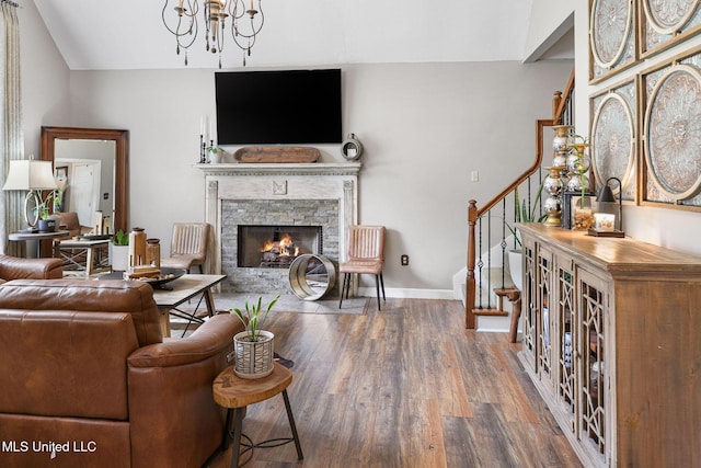 108 Kenbridge Ln, Madison, MS 39110 - living area with stairs, wood finished floors, a fireplace, baseboards, and a chandelier