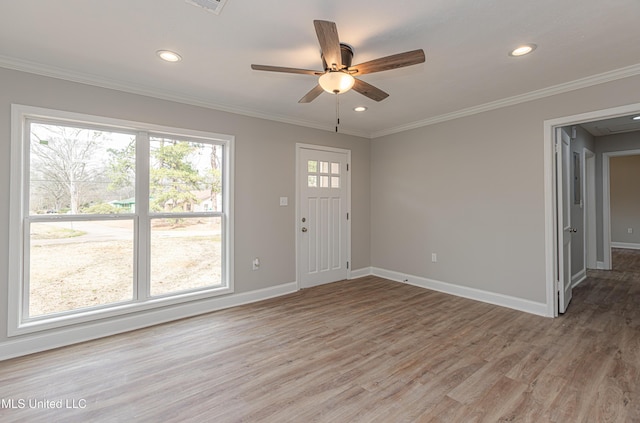 entrance foyer with ceiling fan, ornamental molding, and hardwood / wood-style floors