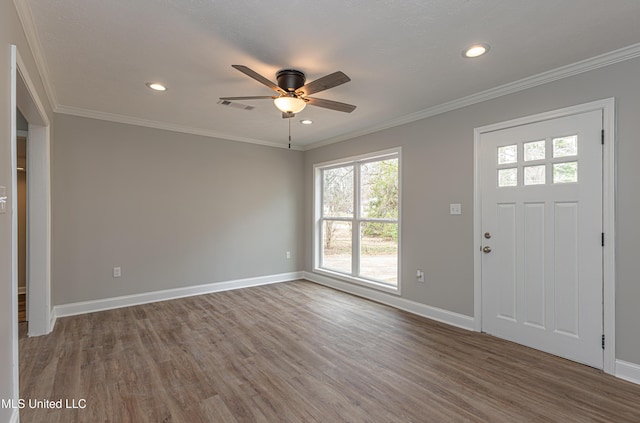 entrance foyer featuring crown molding, wood-type flooring, and ceiling fan