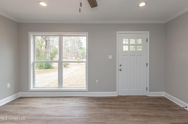 entryway with crown molding, ceiling fan, and hardwood / wood-style floors