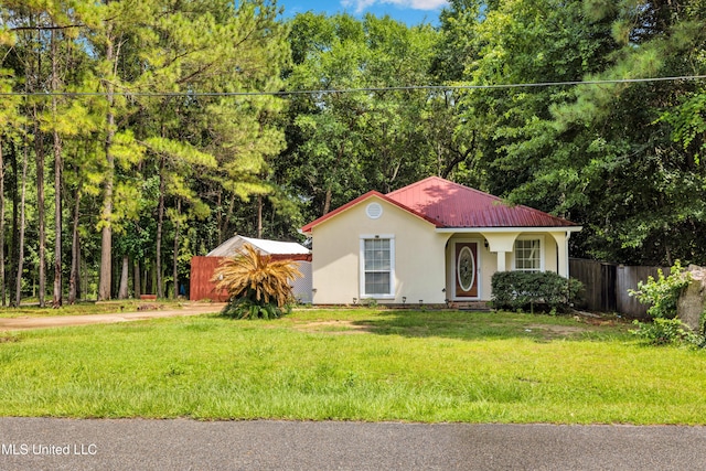 3005 Robalo Dr, Gautier, MS 39553 - view of front of home featuring stucco siding and a metal roof
