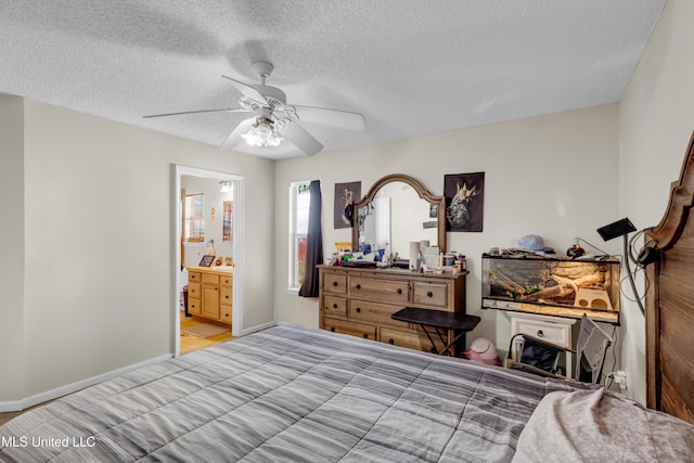3005 Robalo Dr, Gautier, MS 39553 - bedroom with a textured ceiling, a ceiling fan, and ensuite bath