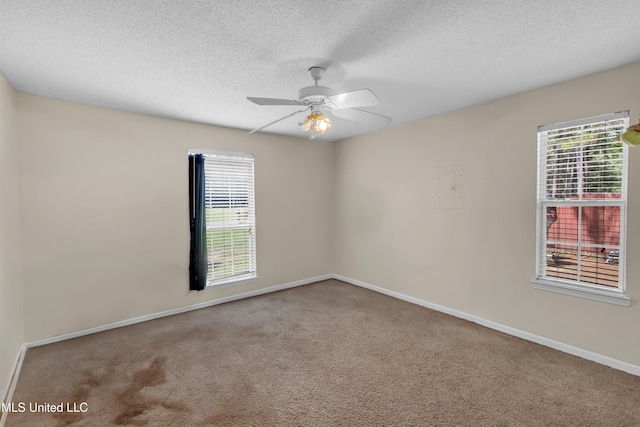 3005 Robalo Dr, Gautier, MS 39553 - carpeted empty room featuring a textured ceiling, a ceiling fan, and electric panel