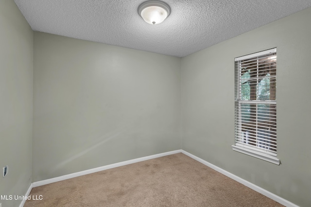 3005 Robalo Dr, Gautier, MS 39553 - unfurnished room with carpet flooring and a textured ceiling