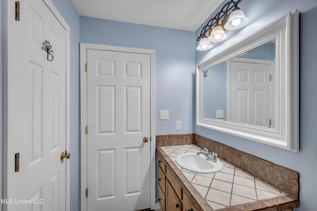3005 Robalo Dr, Gautier, MS 39553 - bathroom with vanity and a textured ceiling